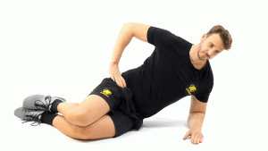 SIN MATERIAL-SUELO-PIERNAS-ELEVACION DE PELVIS LATERAL CON RODILLAS FLEXIONADAS